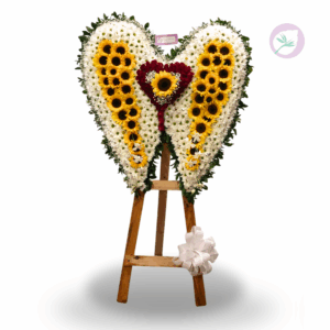 Un homenaje lleno de paz y significado. Nuestro arreglo fúnebre Alas de Despedida está diseñado en forma de alas, simbolizando el descanso eterno, la protección y el amor que permanece incluso después de la partida.
